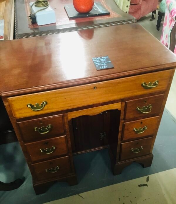 Small knee hole desk with 19th century brass fittings