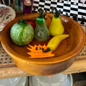 Wooden bowl with glass fruit