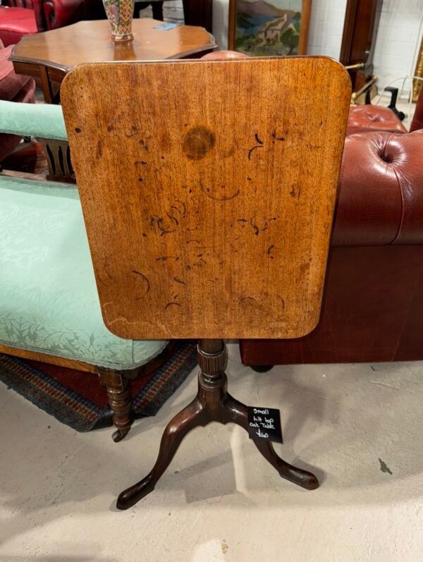 Small tilt top oak table