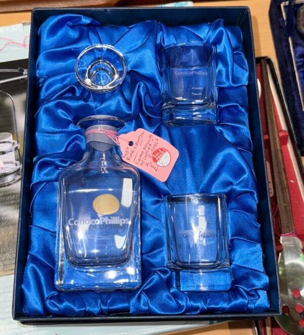 Boxed rock crystal ConocoPhillips decanter and 2 glasses
