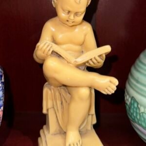 Resin boy reading