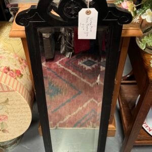 Vintage black mirror with bevelled glass