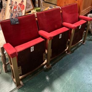 Row of three folding cinema seats
