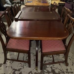 Reproduction Georgian dining table on twin sabre leg pedestals in mahogany with single leaf extending to 210cm by 100 cm (height 75cm) with a set of six reproduction chippendale chairs