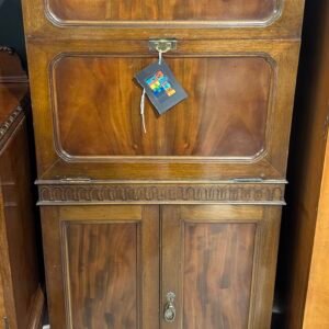 Early 20th century walnut drinks cabinet with fall front door