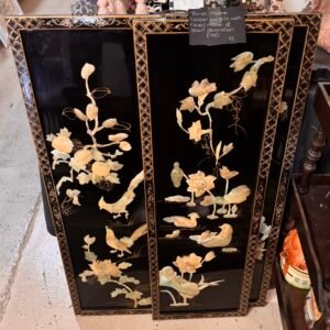 Three Chinese lacquer panels with raised mother of pearl decoration